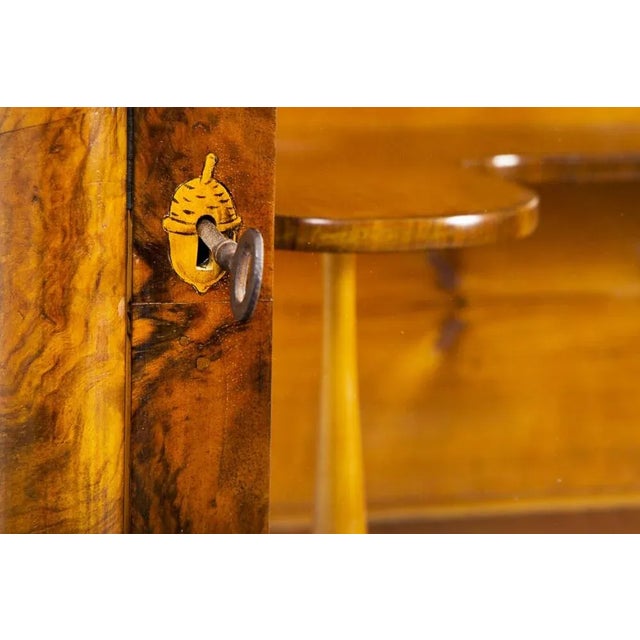 This item features classic Biedermeier elements. Visual simplicity, light-colored woods, and contrasting inlays...
