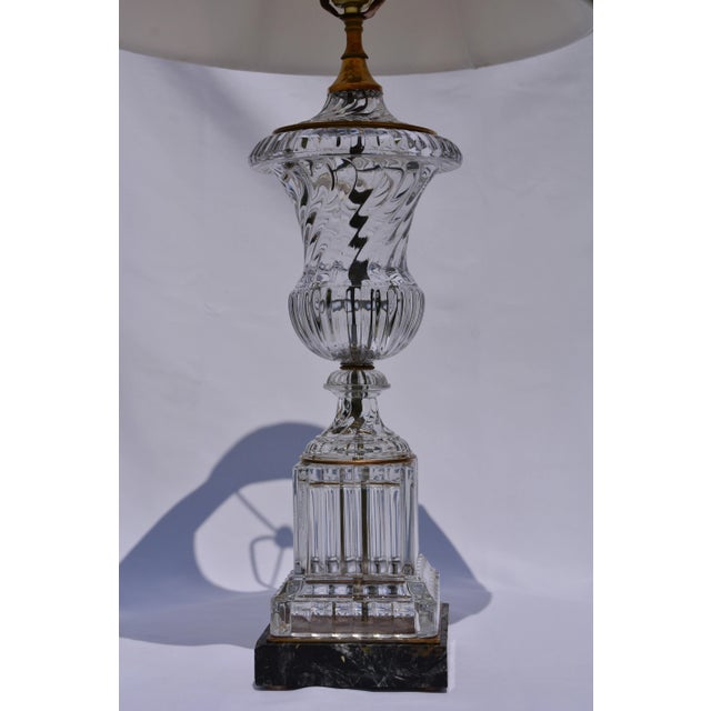 Baccarat style swirl urn lamp. Neoclassical crystal glass and brass on black marble. This spiral fluted crystal glass,...