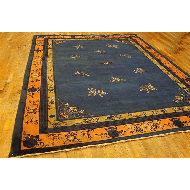 Antique Chinese Peking Allover Floral Blue 1920s Rug, Circa Date: 1920s. This magnificent example of early 20th-century...