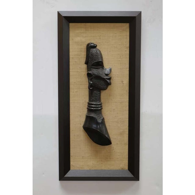 One of a kind pair of beautifully-carved wooden wall sculptures of an African couple. Most probably from a region in DR...