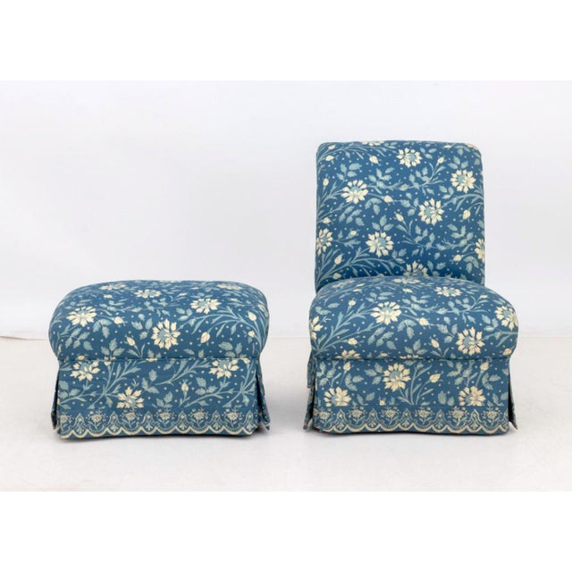 Blue Floral Print Upholstered Slipper Chair and Ottoman. Chair: 33" H x 25" W x 31" D; seat: 16" H. Provenance: From a...
