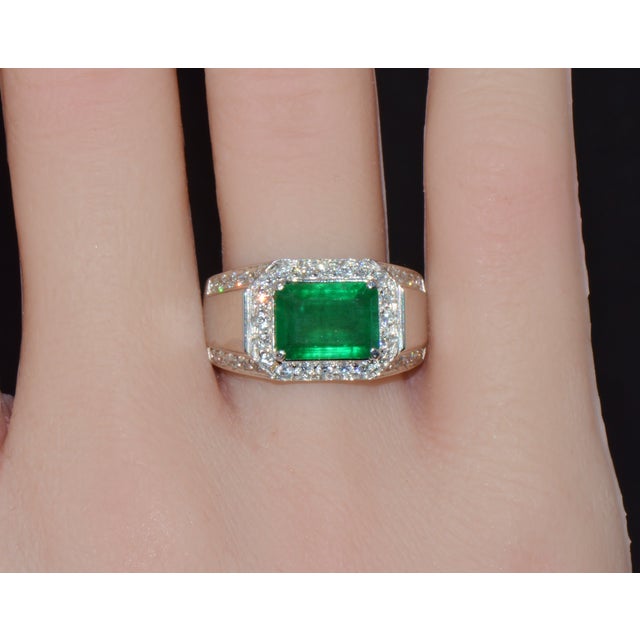 Certified natural 18K solid white gold emerald and diamond ring. This ring features a large 2.20CT natural emerald,...