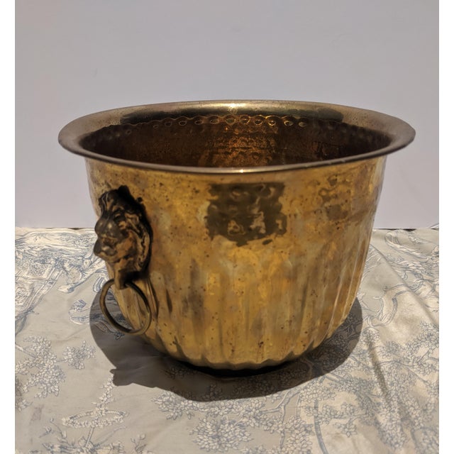 Vintage Hammered Brass Cachepot featuring Lion's Head Ring Pulls on each side Could be used to hold an orchid flower, or...