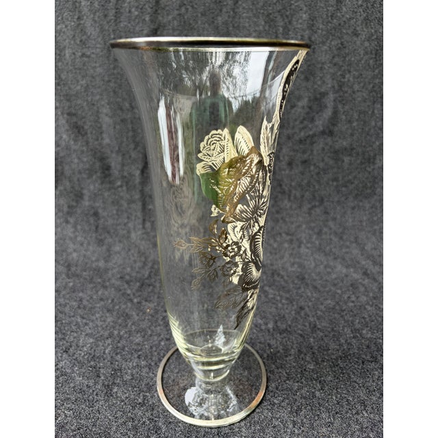 Tall vintage clear glass vase accented with an intricate sterling silver floral overlay. Unsigned. Vase measures 4 1/8" in...