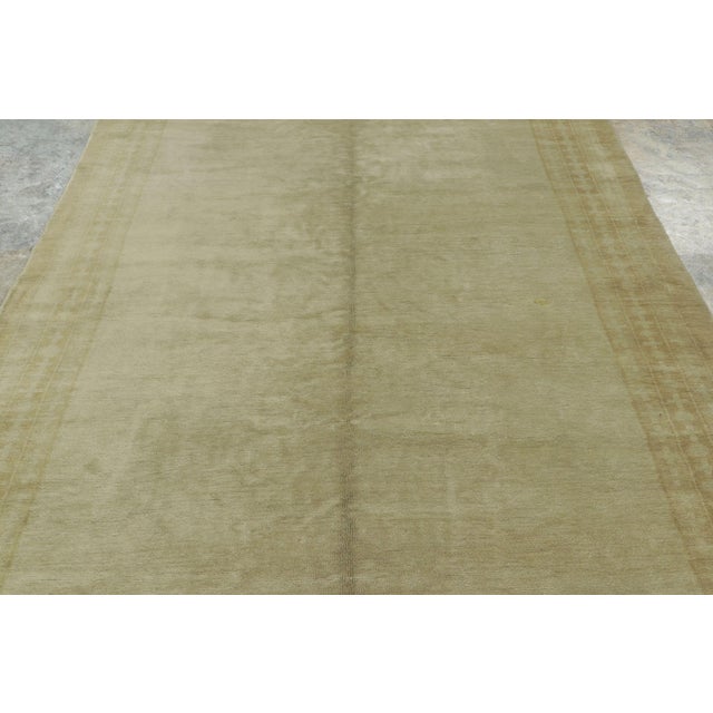 Hand-knotted in wool, this 6x16 antique Oushak gallery carpet, circa 1880–1920. A rare and understated example of early...