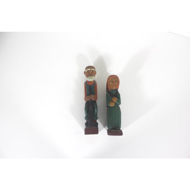 Charming vintage Folk art carved and painted wood man and woman with great detail, but still very rustic and primitive....