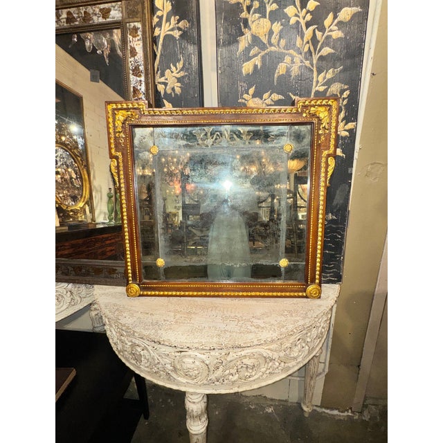 The product is a set of two early 19th century French walnut and gilt mirrors, perfect for adding a touch of elegance to...