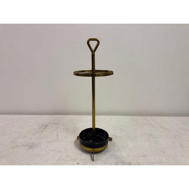This stylish 1950s Italian umbrella stand embodies the refined elegance of mid-century design. Crafted in brass with iron...