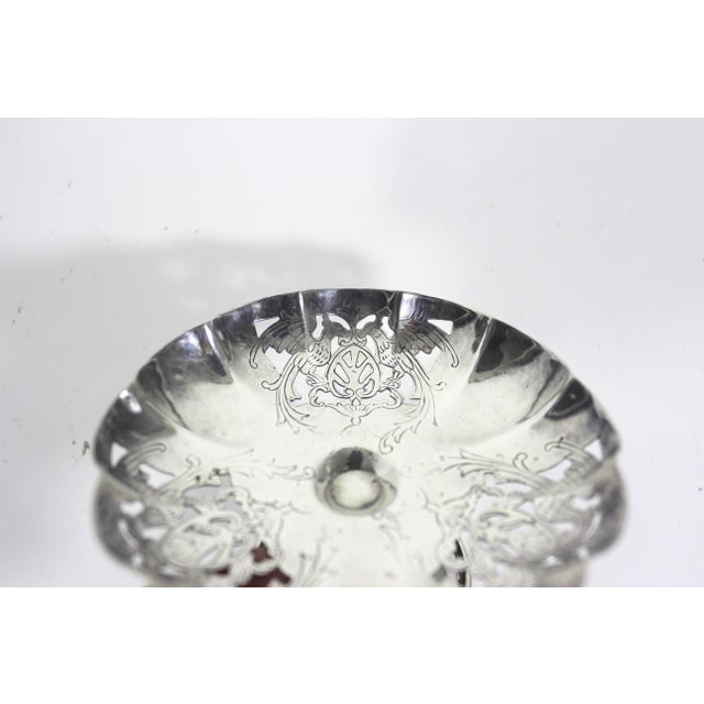 Antique circa 1910 Victorian small silverplated dish with a phoenix and shiel engraved pattern on the inside and outside....