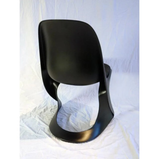 Black Plastic Chair by Alexander Begge for Casala, in Very Good conditions. Designed 1970 to 1979 This piece has an...