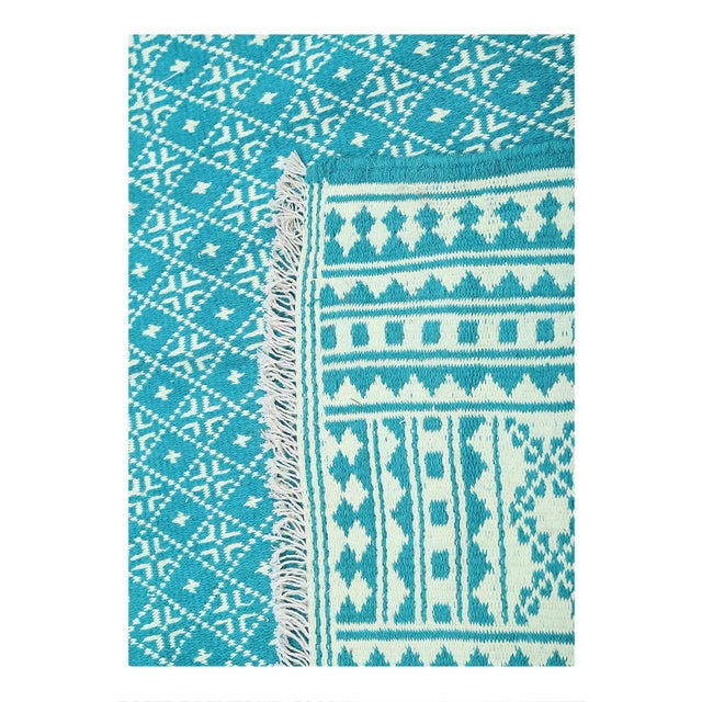 Introducing our stunning sumak cotton rug, a true masterpiece of traditional weaving techniques and bold design. Using the...