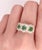 Three Stone Emerald & Diamond Modern Ring. . Housing approx. Three sixty point round emerald stones for a total of 1.8 ct....