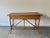 Vintage bamboo and rattan console table / writing desk in classic 1970s–1980s tropical / boho style. Features a woven cane...