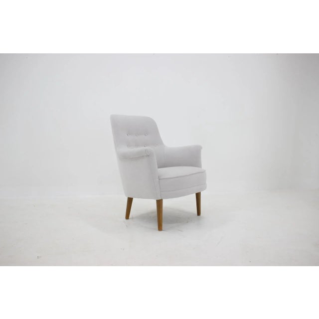 Newly upholstered. Wooden legs have been repolished.