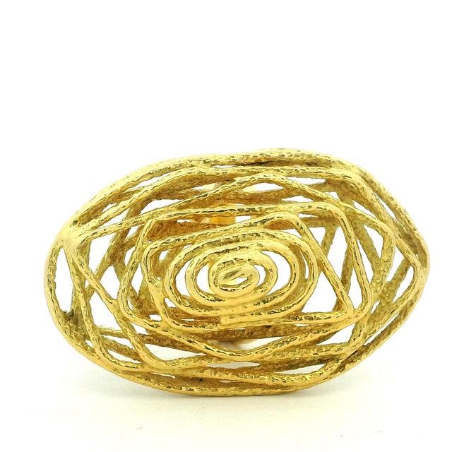 An exceptional Italian Modernist statement ring crafted in solid 18-karat yellow gold. This sculptural design features an...