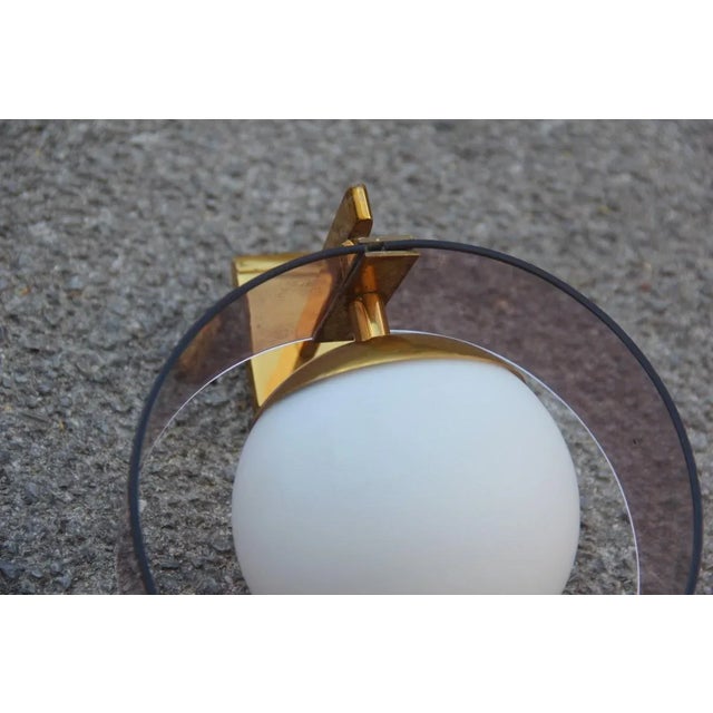 - Round pair of wall sconces - Produced by Stilux - Made of Acrylic Glass, brass, and glass - Equipped with an E14 socket...