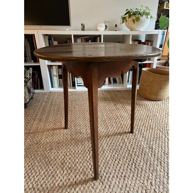 An antique English elm cricket table is a highly sought-after piece of British furniture. This one has been in my family...