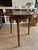 This exceptional late 18th to early 19th-century English elm cricket table is a quintessential piece of British vernacular...