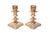 A pair of silver-plated copper candlestick holders. Removable pierced capitals top turned columns. Ornate knops are...