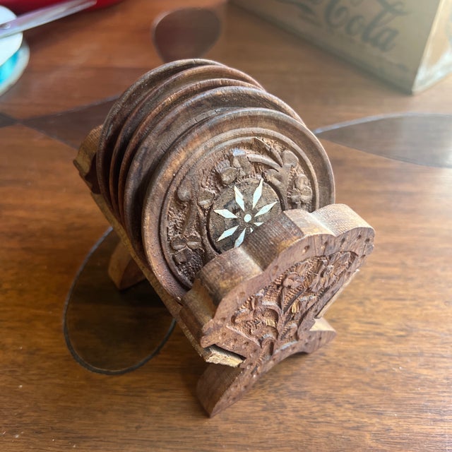 Up for consideration is a beautiful vintage collection of hand carved wooden coasters with a holder. These would look...