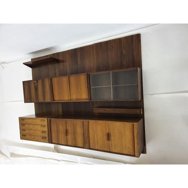 About this item Largewall unit with wooden back plate by Kai Kristiansen. The cabinet has some traces of use like stains,...