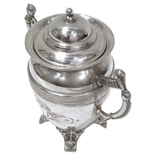 Edwardian silver-plate lidded sugar urn featuring double stylized handles and foliate decoration on the body and supported...