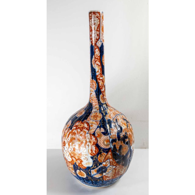 We are selling this gorgeous Japanese Imari Iron red and blue bottle vase. This vase has traditional Imari decoration in a...