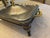 Vintage silverplate covered casserole server featuring an ornate footed frame, pierced gallery detail, and removable glass...