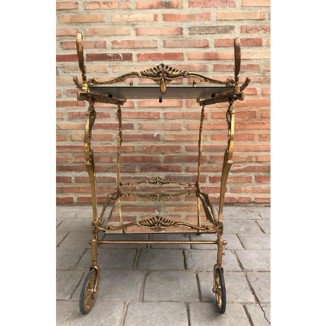 This elegant bronze bar cart dates from the mid-20th century and is inspired by classic French decorative traditions. The...
