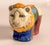 Raku Pottery Lion Figurine crafted in South Africa, featuring a multicolored design with yellow, blue, green, and red...