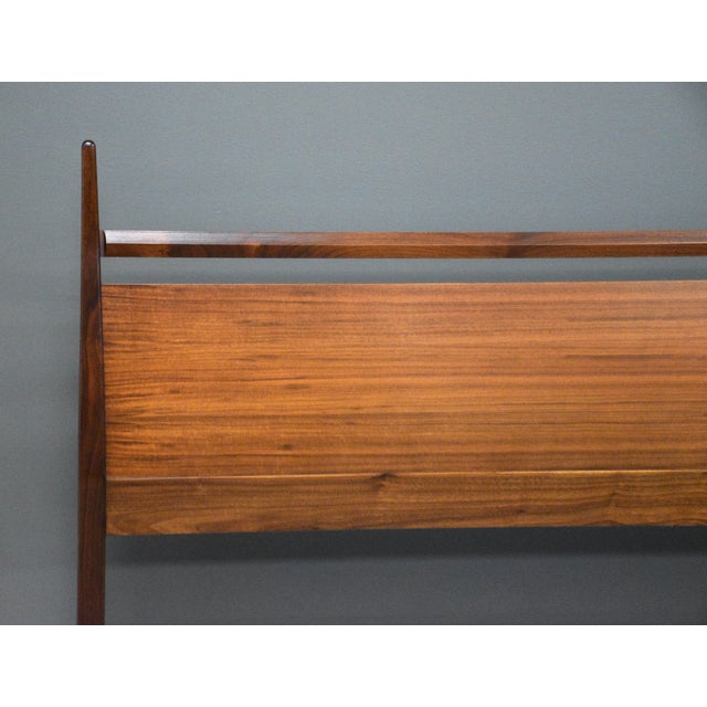 A mid century modern walnut full size bed with beautifully sculpted posts. Professionally refinished. Dated 1964. Made in...