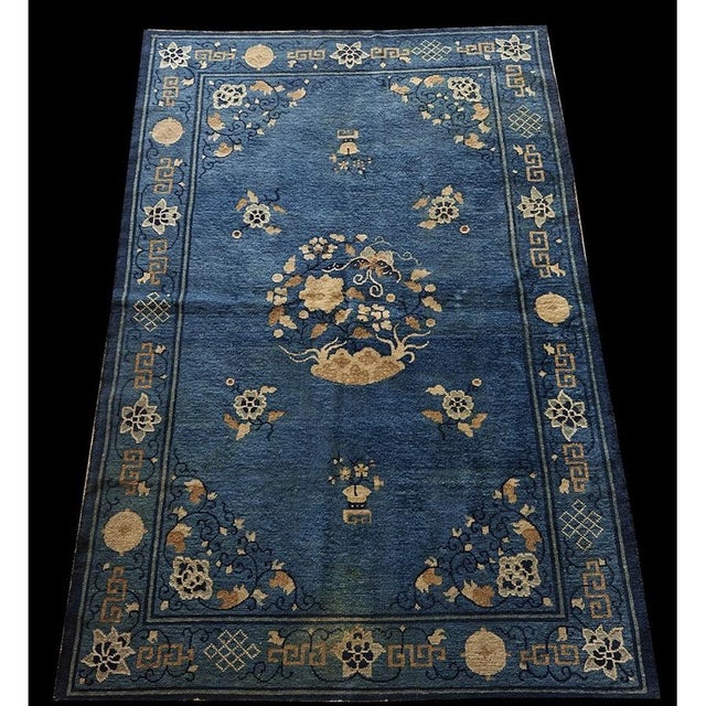 Antique Peking Small Scatter Size Wool Blue Rug, Circa Date: 1920s. This exquisite example of early 20th-century Chinese...