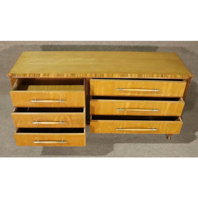 Detailed Italian dresser with beautiful wood grain throughout. Six drawers accented by brass hardware.