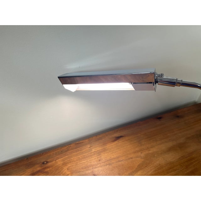 1960s chrome desk lamp with pivoting arm & adjustable angle head by Koch & Lowy. Weighted base. Measurements: Lamp: 6.5" x...