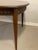 With its curved, alternating geometric detail, this mid-20th century table by Consolidated Furniture Company of Lenoir,...