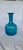Stunning mid-century art glass vase by Kastrup-Holmegaard (Denmark). Featuring a rich teal/turquoise blue exterior paired...