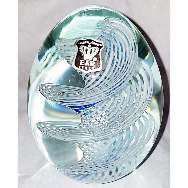 Vintage 1970s blown glass paperweight from Italy by E&R. Mesmerizing swirled blue and white inside.