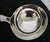 A fine Victorian sterling silver soup or punch ladle dating to 1854, crafted in the classic Fiddle pattern with...