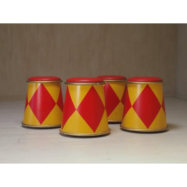 A unique and collectible set of four vintage circus stools, originally from the Euro Disney Hotel in Paris during the...