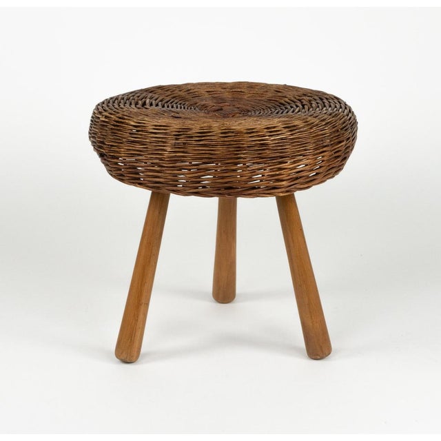 Beautiful midcentury round tripod stool or side table in wicker and wood by Tony Paul. Made in United States in the 1950s....