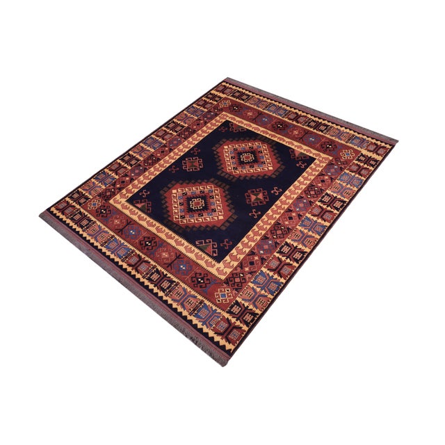 Enhance your home with the timeless craftsmanship of a hand-knotted Kargahi wool rug, celebrated for its tribal artistry,...