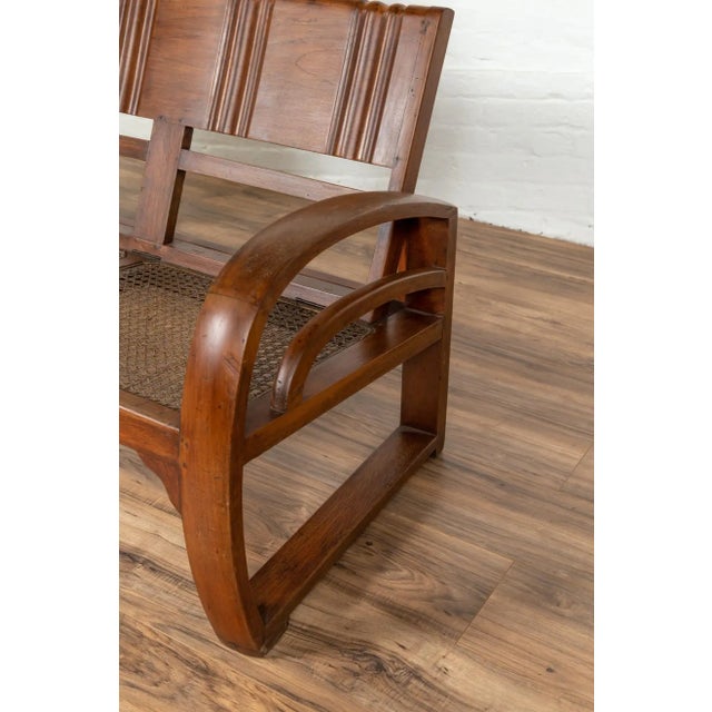 Teak Wood Settee from Madura with Folding Back, Looping Arms and Cane Seat For Sale - Image 10 of 13