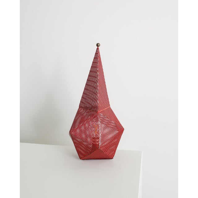 A very rare and decorative french mid century "bagdad" desk table lamp in red lacquered and perforated metal and brass...