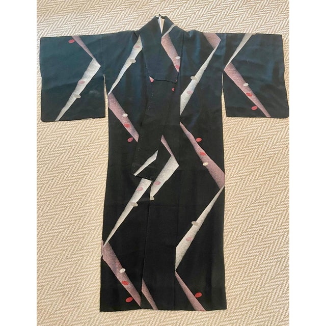 A vintage Japanese formal <a href="/buy/silk-kimonos/">silk Kimono</a> in an "ink green" color with striking geometrical...