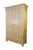 This antique European pine armoire or larder cupboard showcases a rustic, country-style aesthetic highlighted by its warm,...
