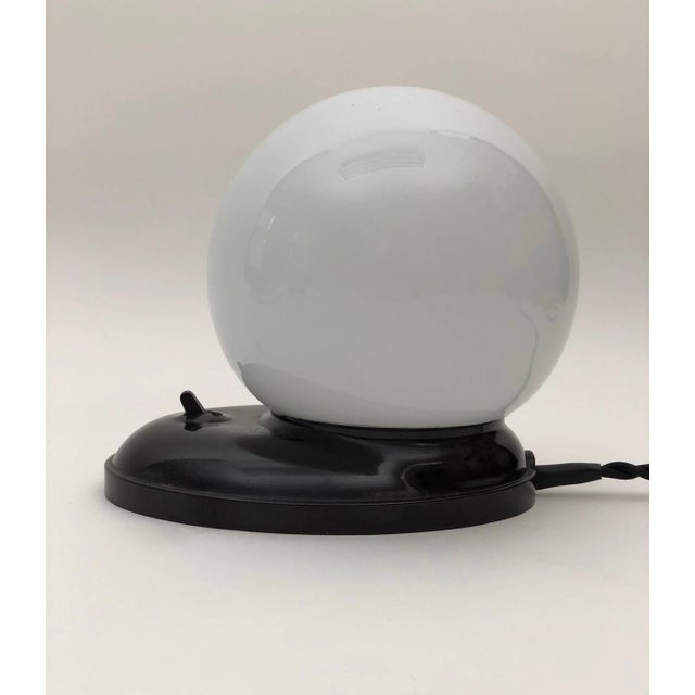 A beautiful, streamlined style Art Deco table lamp with an oval base made from Bakelite. This minimalistic style lamp, is...