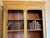 A beautiful and decorative bookcase that is a gem in itself. Nice and tall and shallow with a central pillar. The top rail...