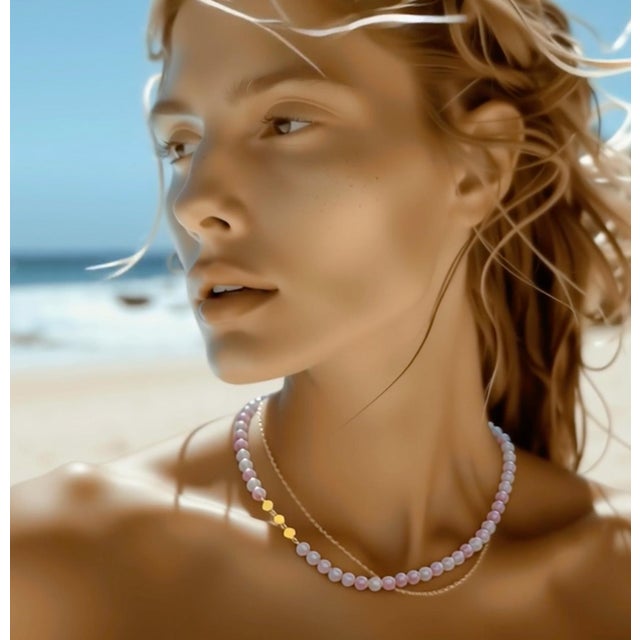 Soft as a whispered secret, this Pink Tourmaline necklace carries the tender blush of dawn, transforming your essence with...