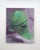 The artwork features a stylized, green-hued figure that evokes a sense of contemplation and introspection against a soft...
