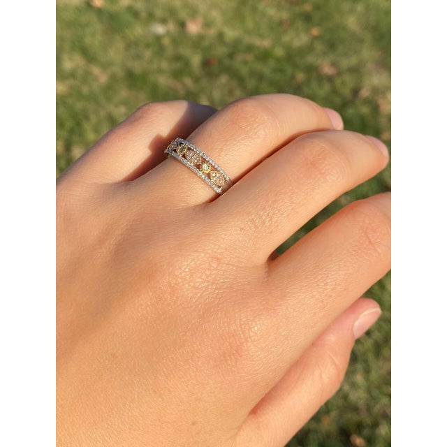 The 101st Avenue: Tri Color Natural Diamond Patterned Band. Presenting a stunning ring showcasing a center adorned with...